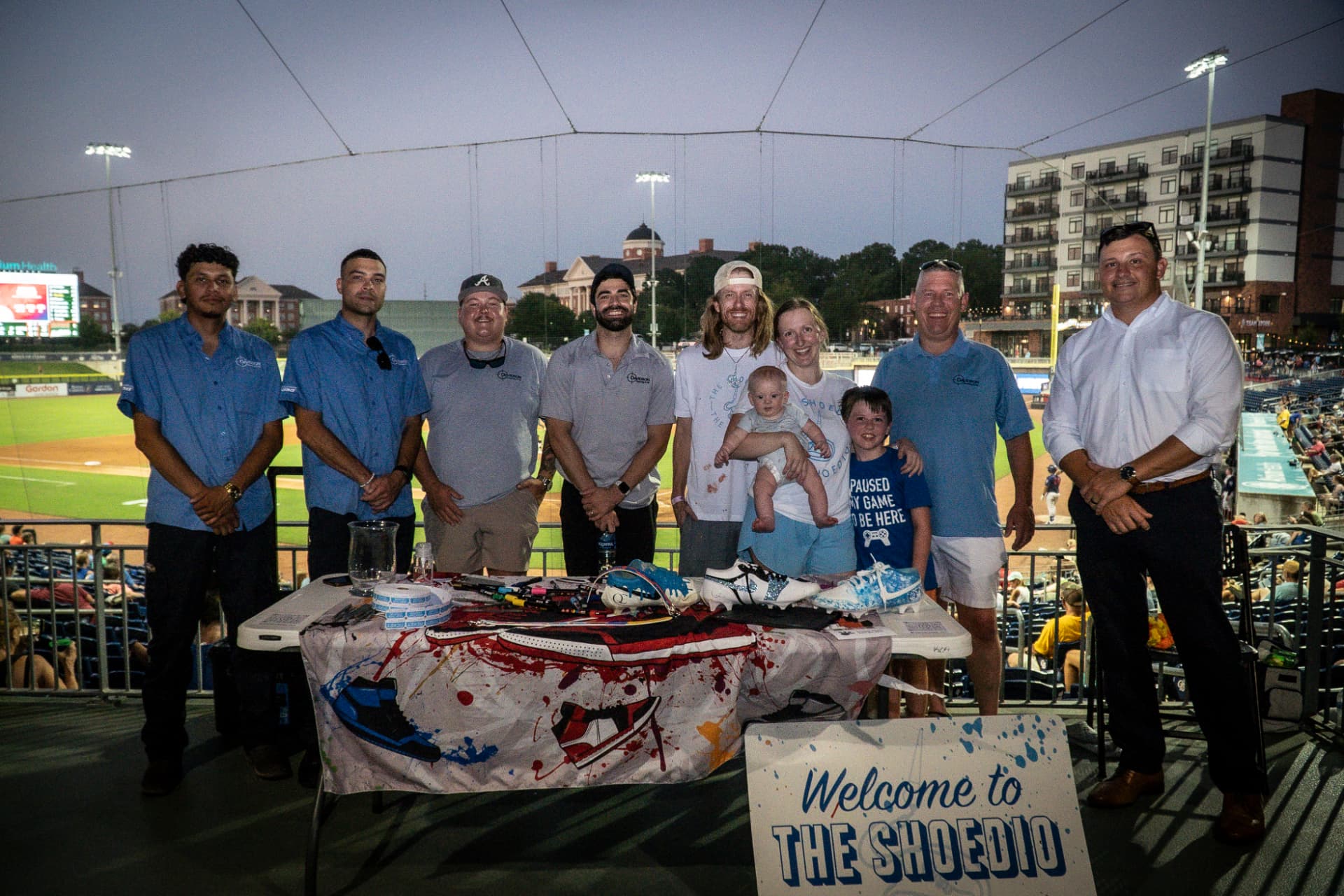 Davidson Heating & Air team with Mike from The Shoedio at the custom art table during Bark in the Park